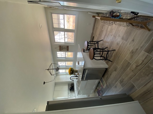 Kitchen after — island with seating, open layout