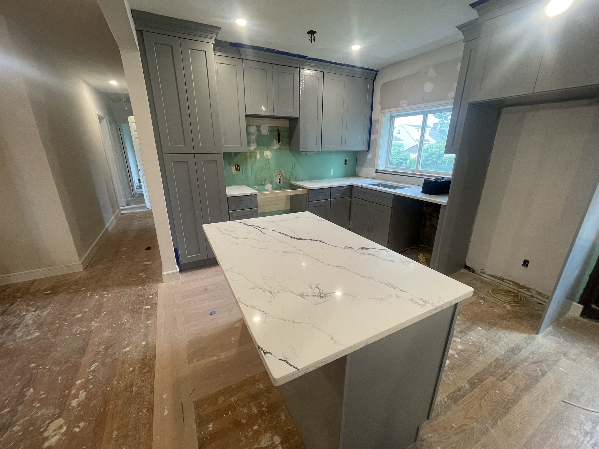 Kitchen nearly complete — quartz countertop island Long Island
